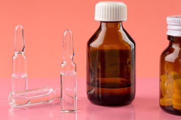 Pills bottles and medicine ampule