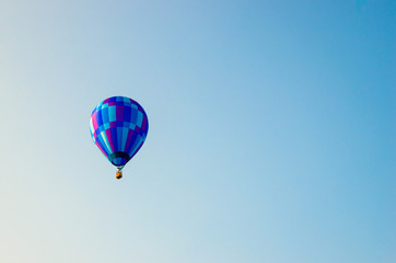 Hot air balloon floating in the blue sky