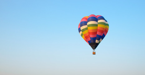 Hot air balloon floating in the blue sky