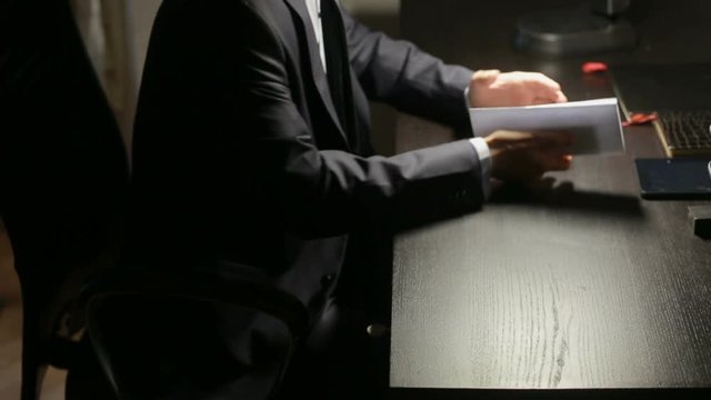 corruption, bribery and fraud concept - close up of businessman taking money
