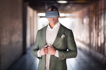 Confident businessman with VR goggles on his head.
