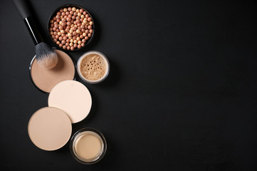 Set of various face powder and brush