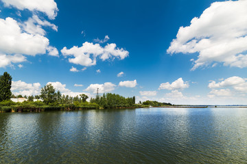 Clean lake and beautiful blue sky with clouds