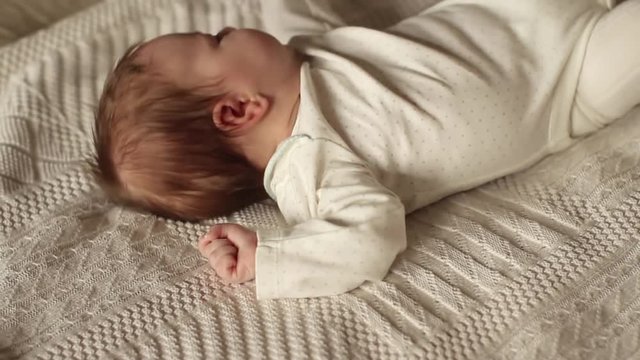 Beautiful Baby Lying on the Bed