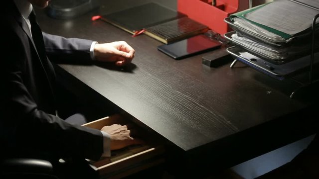corruption, bribery and fraud concept - close up of businessman taking money