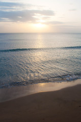 Sunset beach with wave and ripples