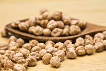 Handful of chickpeas on wood