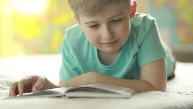  A boy reads a book 