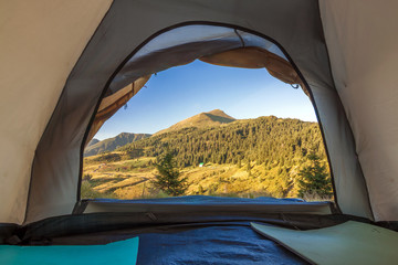 View from inside of hikers tourist tent in mountains © bilanol