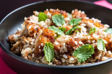 Homemade Chinese fried rice with vegetables and fried eggs