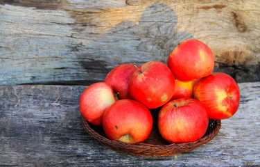 Red apples on wooden background