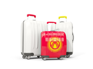 Luggage with flag of kyrgyzstan. Three bags isolated on white
