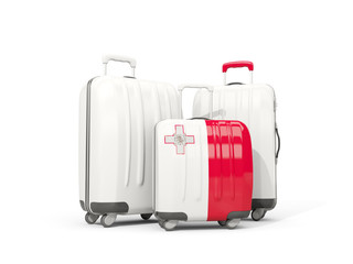 Luggage with flag of malta. Three bags isolated on white