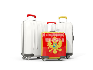 Luggage with flag of montenegro. Three bags isolated on white