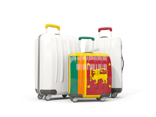Luggage with flag of sri lanka. Three bags isolated on white