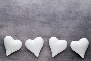 Red hearts the gray background. Valentine Day background.