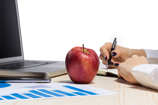 Business woman in an office holding red apple - Clipping Path