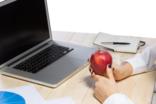 Business woman in an office holding red apple - Clipping Path