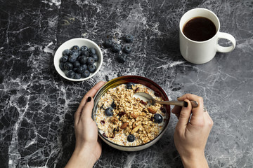 Granola served with coffee and milk 