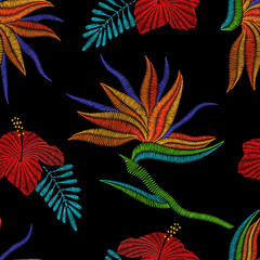 Embroidery Bird of Paradise flowers, tropical Strelitzia, hibiscus seamless pattern. Vector fashion ornamental floral print on black background for fabric traditional folk decoration. - 138449134
