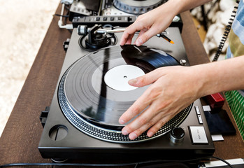 Dj mixes the track in club