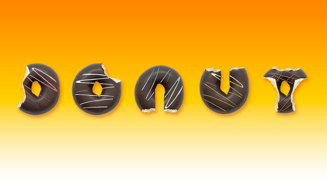 Delicious donuts with shape of letters on yellow background. Advertising concept.