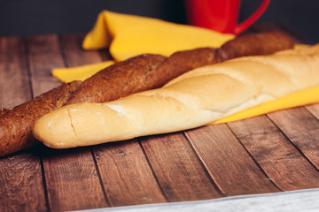 Fresh baguettes on a wooden table