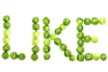 The word 'like' is spelled out with brussel sprouts on a white background to provide a visually engaging image to get across the important message of healthy eating, especially of green vegetables