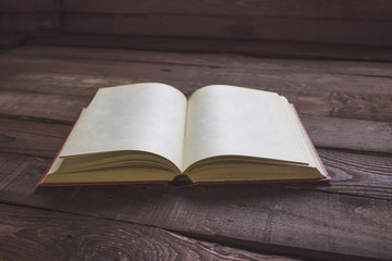 Open book blank on wooden table
