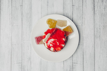 cake and colorful marmalade in a plate