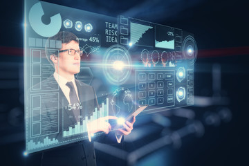 Businessman using device with charts