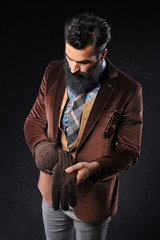 Obraz premium Bearded male in brown suit and gray pant with sunglasses