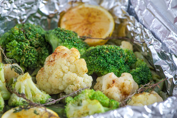cauliflower and broccoli with lemon, spices and thyme baked in foil 