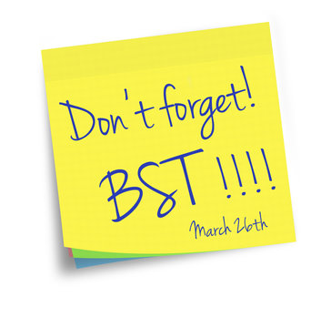 Daylight savings, BST starts. Sticky note reminder.Western European summer time. Clocks forward.