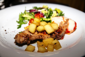 Rabbit leg with apple confit and vegetable salad