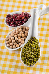 mix of beans on wooden table