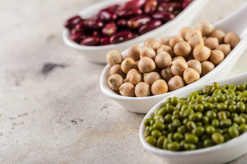 mix of beans on wooden table