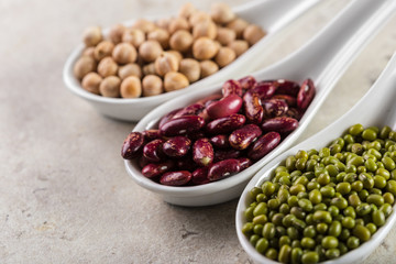 mix of beans on wooden table