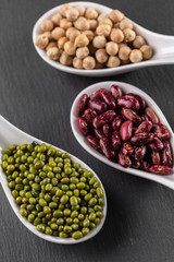 mix of beans on wooden table