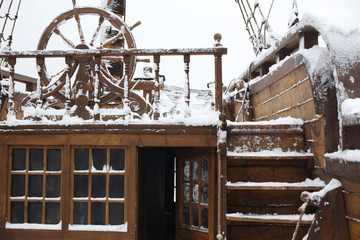 Elements of the old sailing ship in the snow