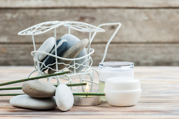 Aroma sticks, pebbles and lit candle