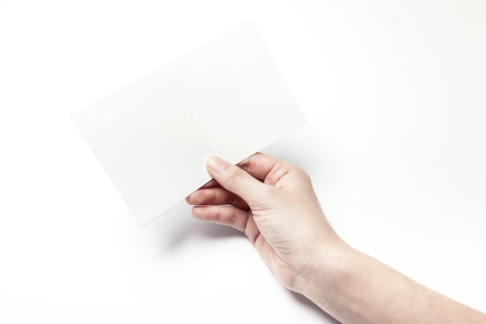 Woman Hand Hold A Empty Post Card Isolated White.