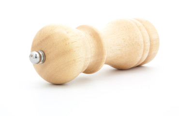 pepper mill of wood with peppercorns