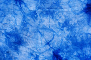 Pattern of blue tie batik dye on cotton cloth, Dyed indigo fabric background and textured, Painted...