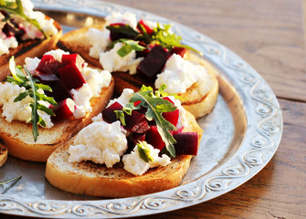 Bruschetta with beet, feta and ruccola