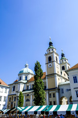 Fototapeta na wymiar Ljubljana, market stands in front of cathedral Saint Nicholas, S