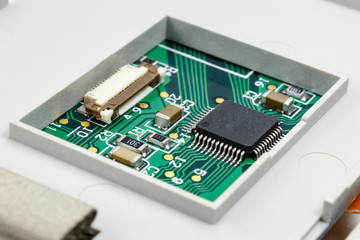 Circuit board with installed electronic components in the housing