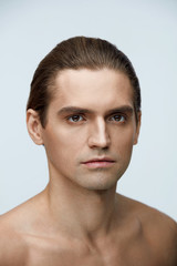 Fototapeta premium Skin And Body Care. Handsome Young Man With Clean Healthy Skin