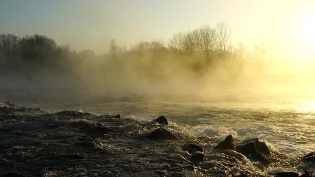 Fast flowing river in the mist