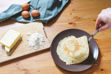 Top view of ingredients for making traditional pancakes.
